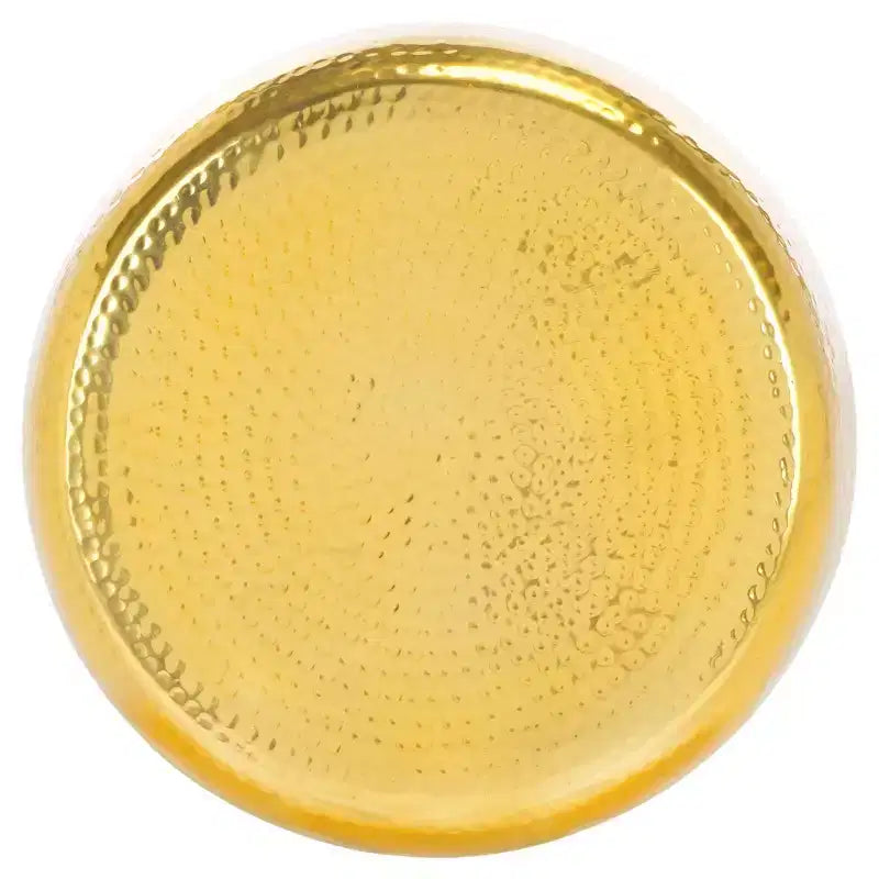 Tavolino rotondo d'appoggio, piano martellato color oro champagne con base in vetro verde